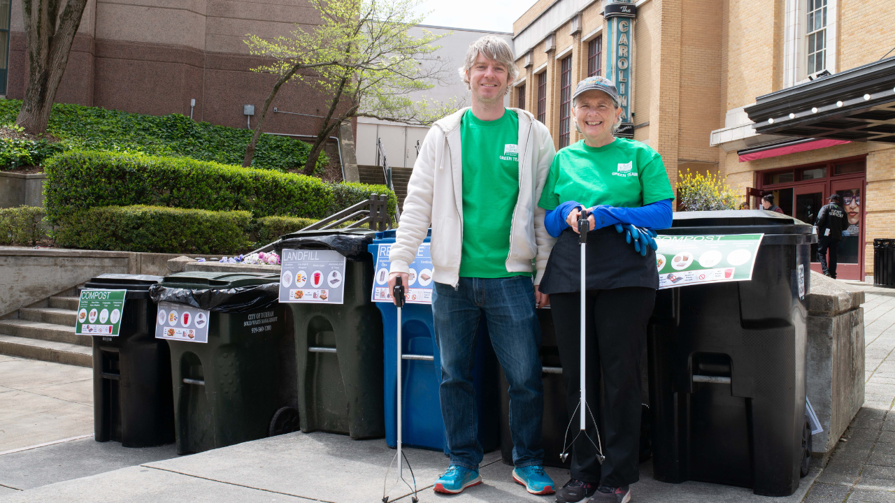 Two Green Team members in the festival Plaza