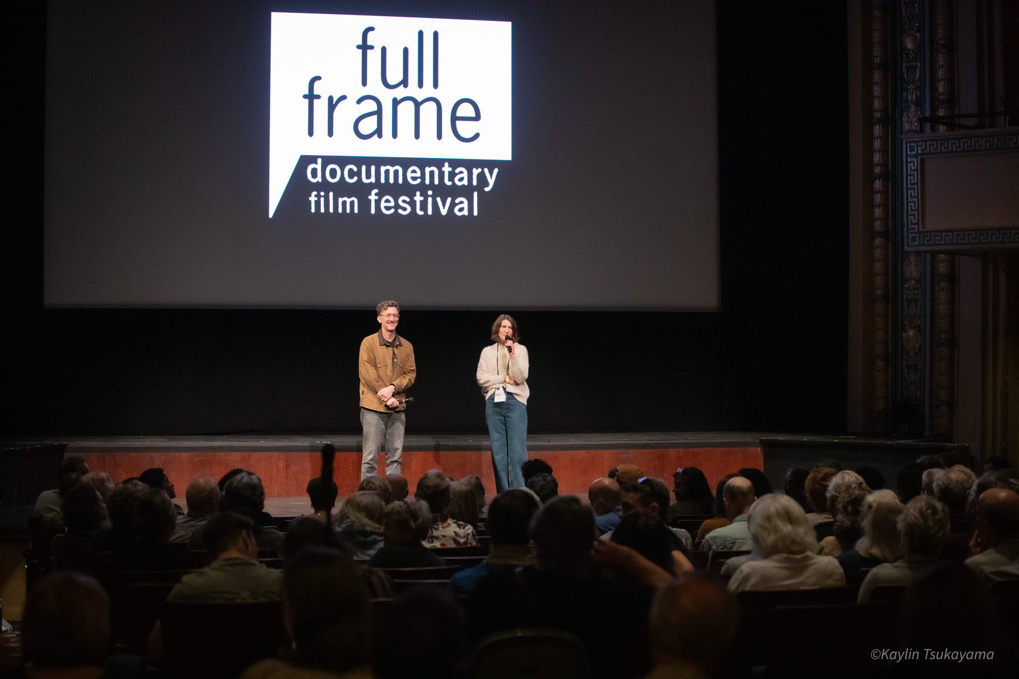 David Borenstein stands with Sadie Tillery onstage at full frame in 2025