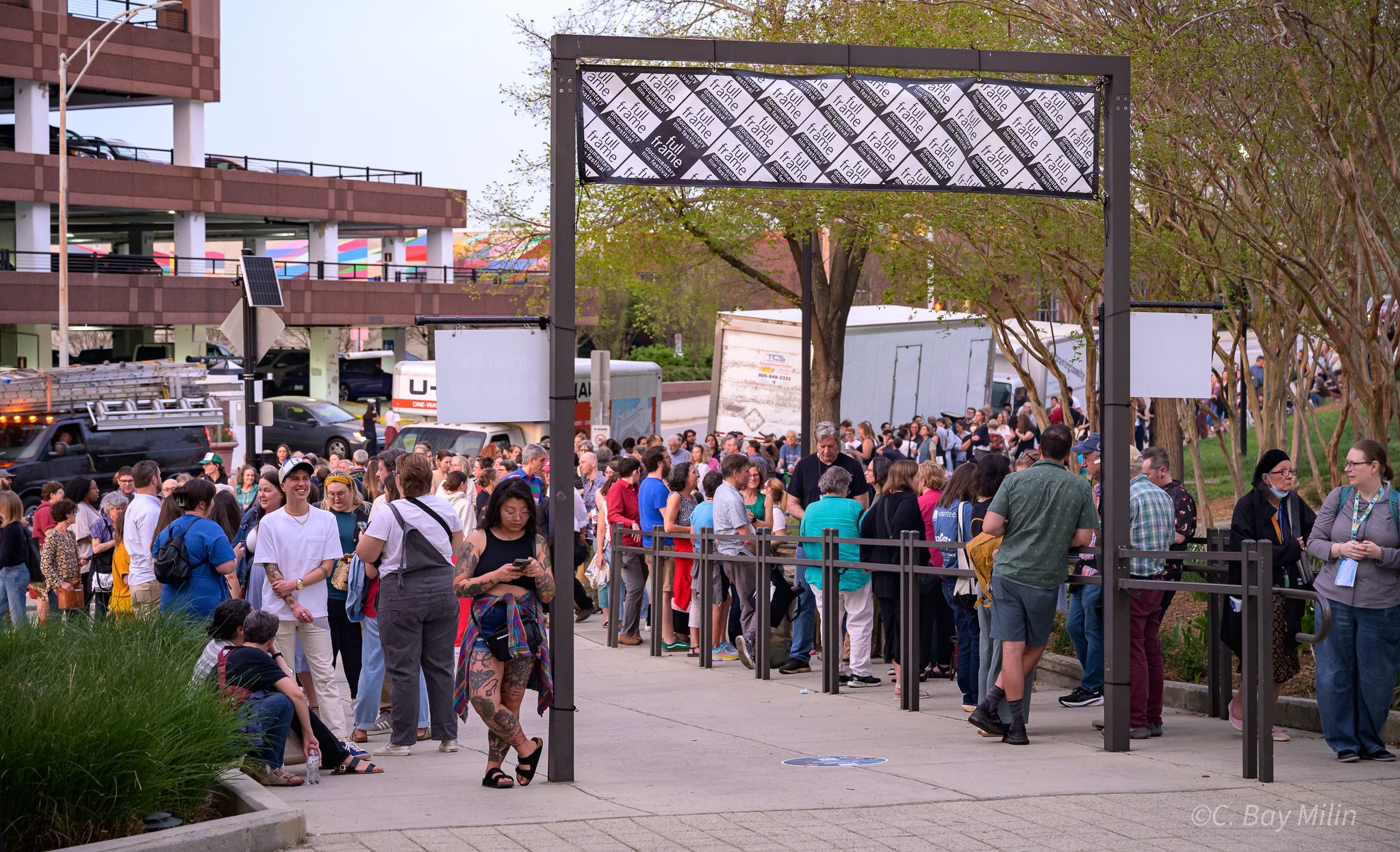 patrons standing in line on the plaza